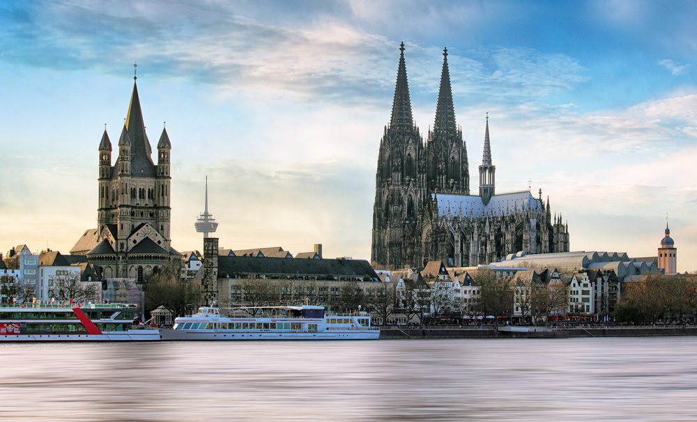 Cologne over the Rhine River with cruise ship in Cologne, Germany.